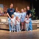 The families behind FamBed gathered in their pyjamas in front of the showroom bed