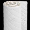 Partially rolled FAMBED mattress topper with a quilted white cover and linen-coloured trim
