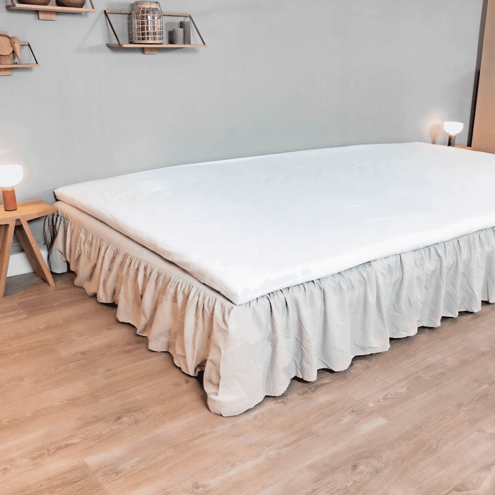 Ruffled made-to-measure FamBed bed skirt covering the bed base down to the floor
