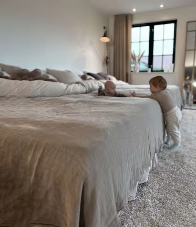 Family sleeping together in a 360 cm-wide FAMBED® family bed
